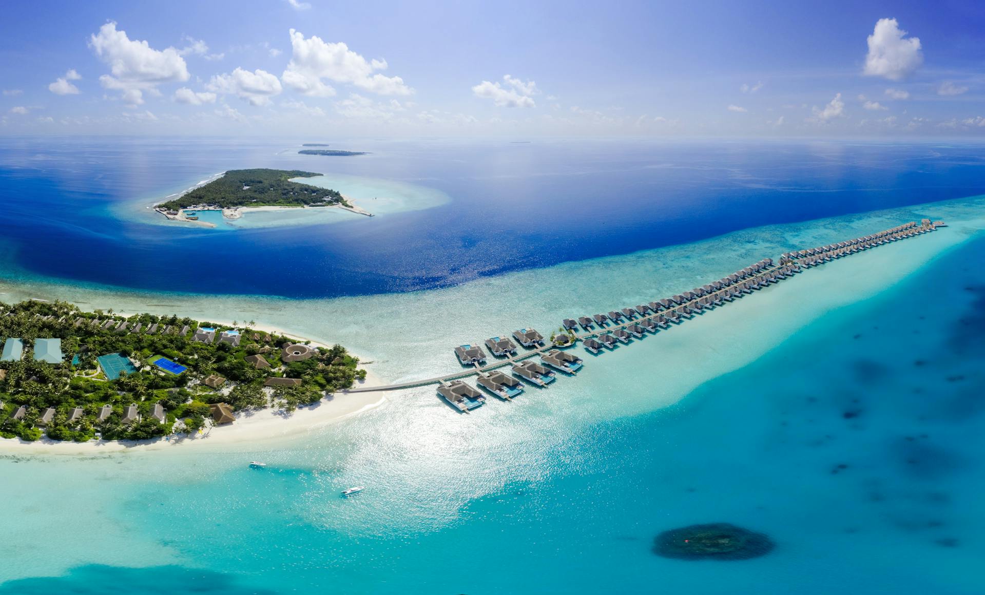 Maldives overwater bungalows on turquoise ocean